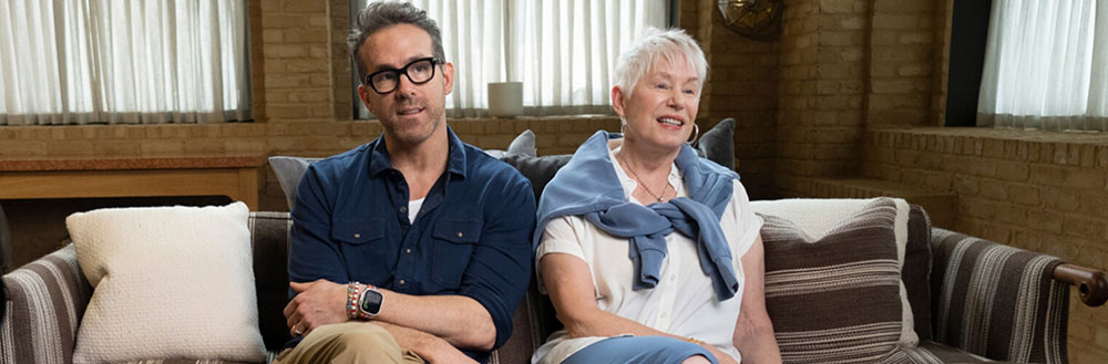Image of Ryan Reynolds sitting with his mother