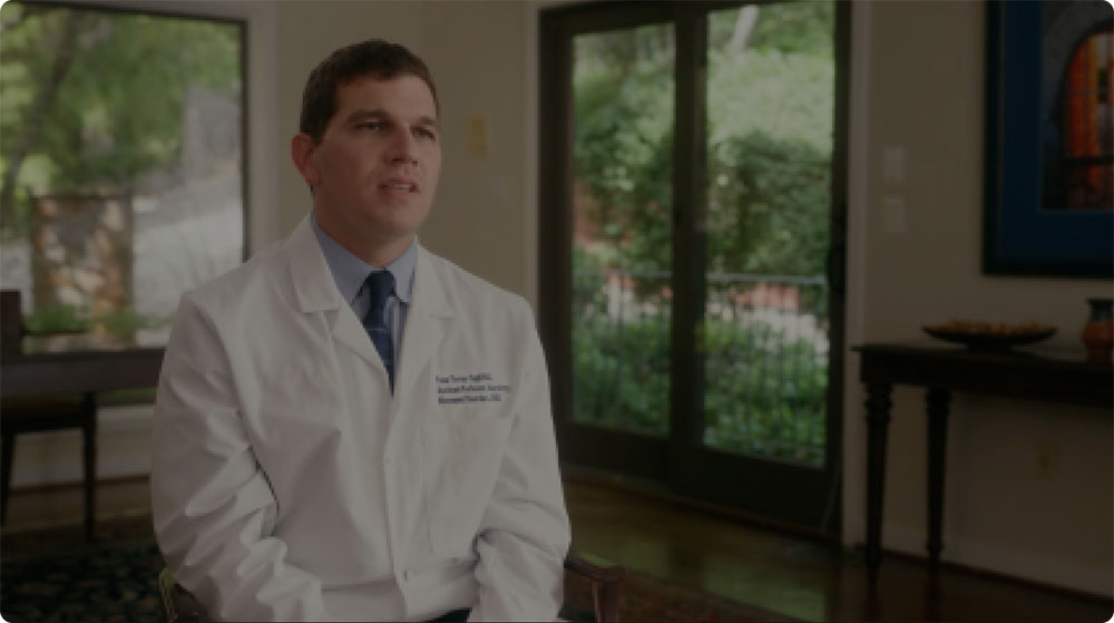 Video play button featuring an image of Dr.Yasar Torres-Yaghi